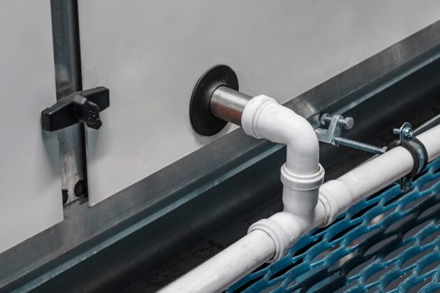 Why a Clogged AC Drain Line Becomes a Plumbing Emergency in Summer Heat